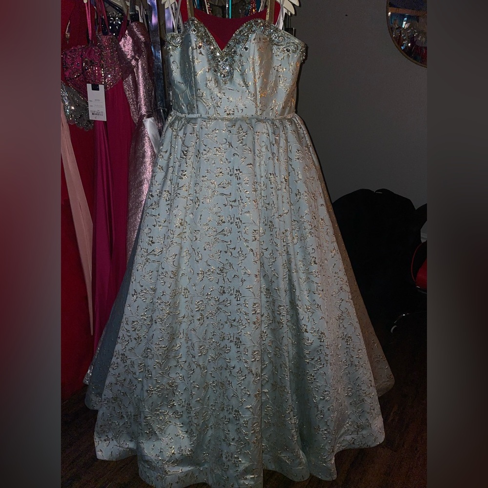 MacDuggal size 16, corset added to fit up to size 20. Straps or strapless.